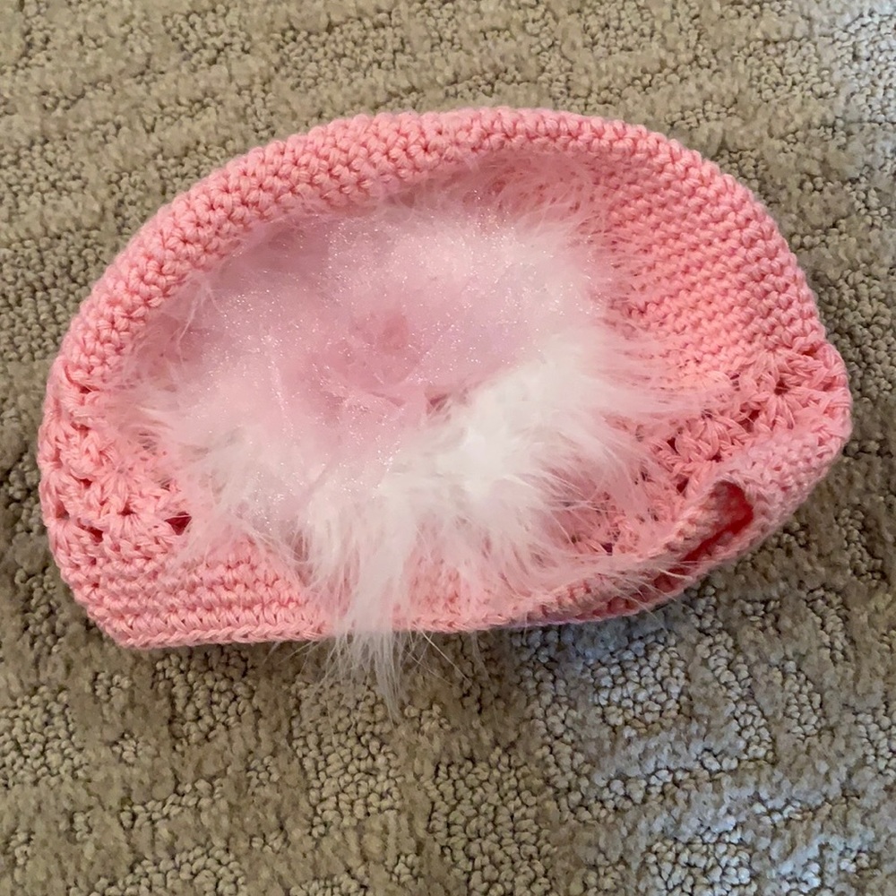 Adorable pink baby girls hat with white puff